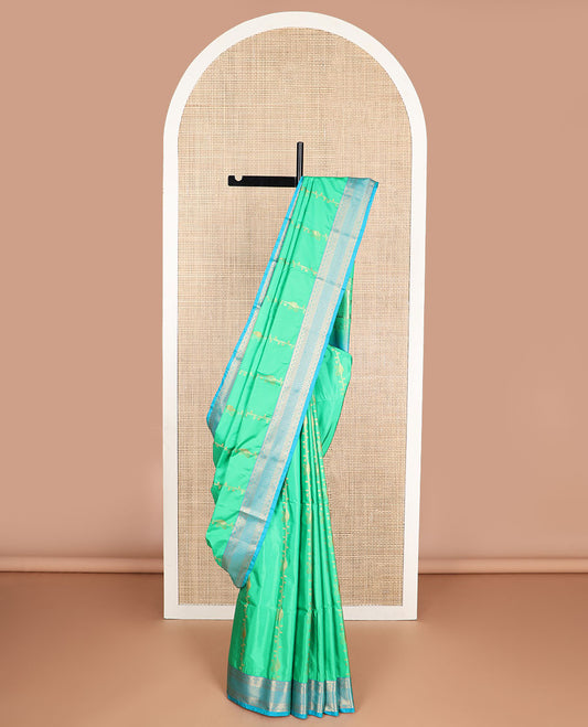 Sea green floral design soft silk saree with contrast intricate zari design border & paisley design pallu