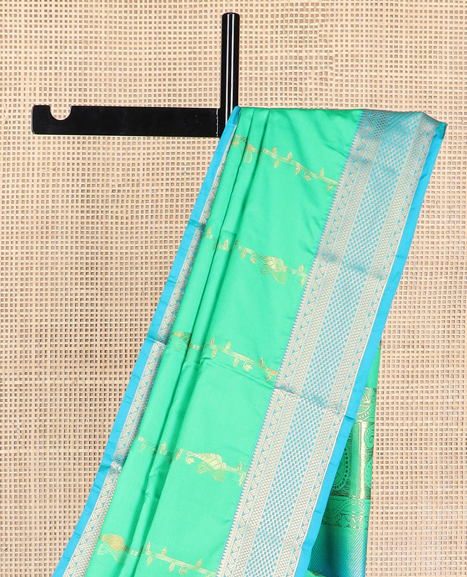 Sea green floral design soft silk saree with contrast intricate zari design border & paisley design pallu