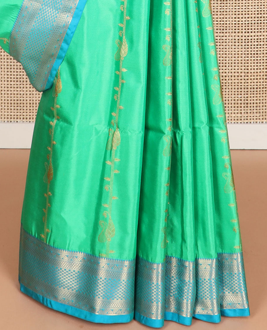 Sea green floral design soft silk saree with contrast intricate zari design border & paisley design pallu