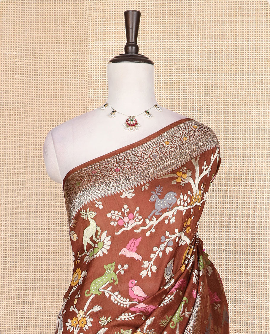 Brown floral vine and animal motifs meenakari design Matka silk saree, traditional design border, and intricate pallu