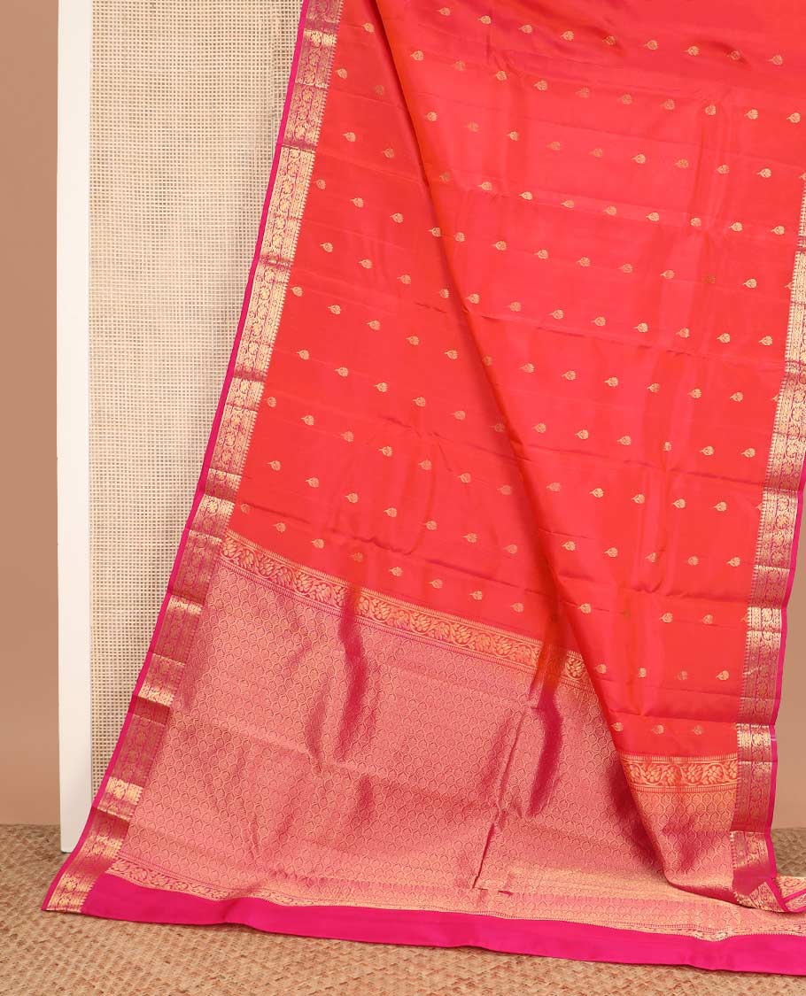 Orange floral buttas Vasundhara silk mix saree, contrast border of thilakam, muthu, cross kamalam, and kodi visiry designs, and ogee patterned pallu