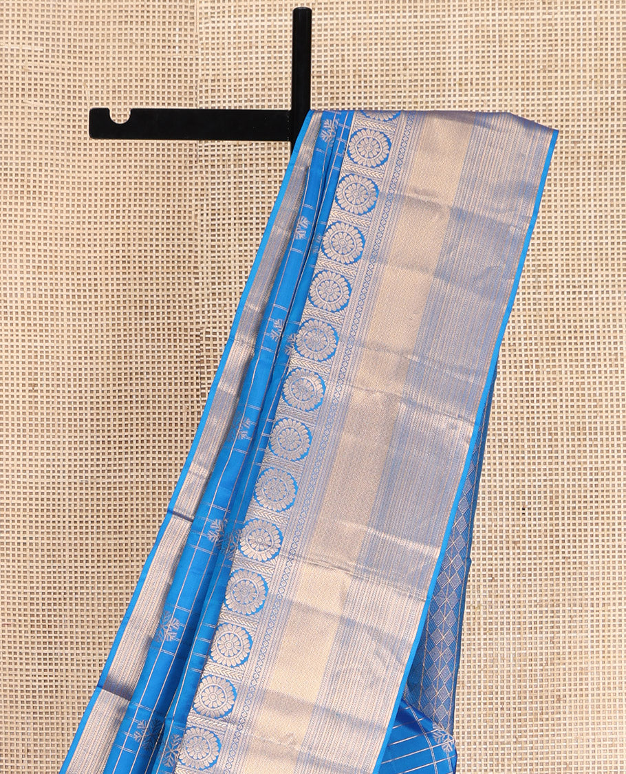Blue Vasundhara Lite-Silk Mix Saree, Artfully Woven with Snowflake Buttas Enclosed Checks, Highlighted by Zari Border of Rekku, Chakram, Kathir, and Diamond Designs, Gleaming Jaal Pallu, and Paired with a Matching Blouse