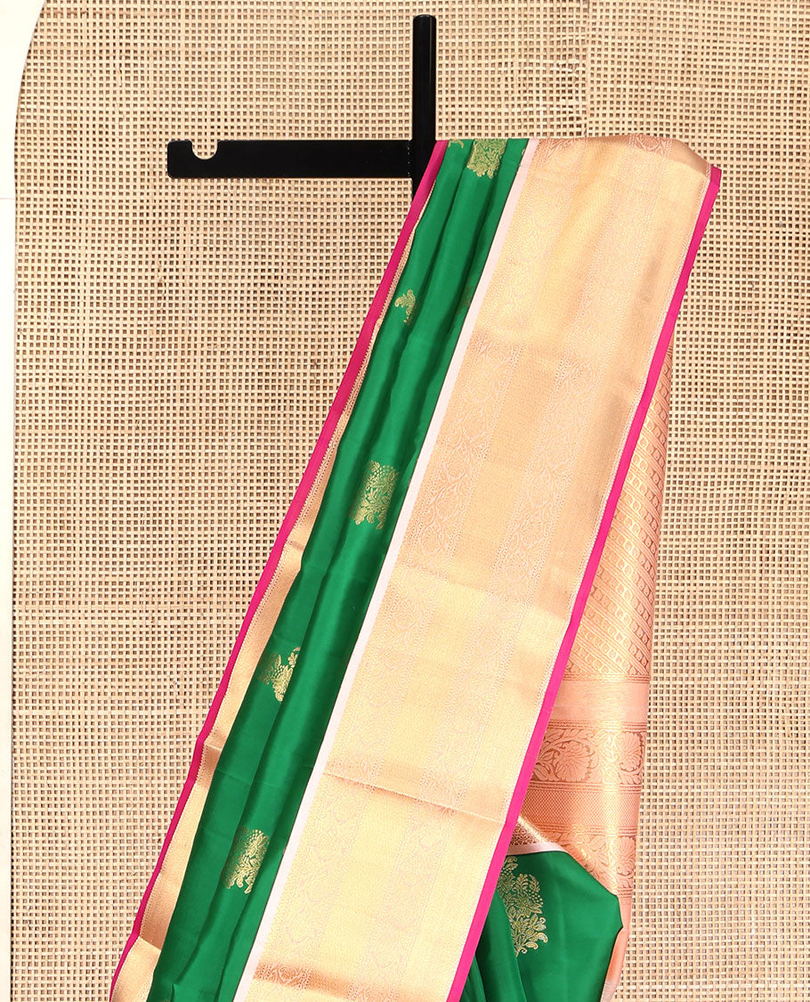 Green Vasundhara Lite Silk Mix Saree, Accentuated with Zari Buttas All Over Its Body, Complemented by a Contrast Border of Muthu, Kodi Visiry, and Mayil Kann Designs, Pallu Steeped with Stripes and Thilakam Designs, and Paired with a Contrast Blouse