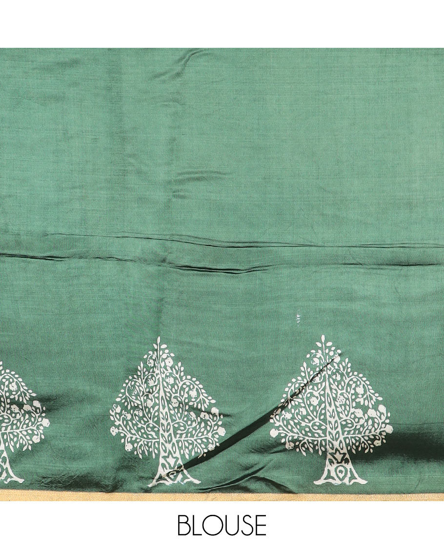 Green tree motifs printed banana pith saree, zari border, and floral printed pallu