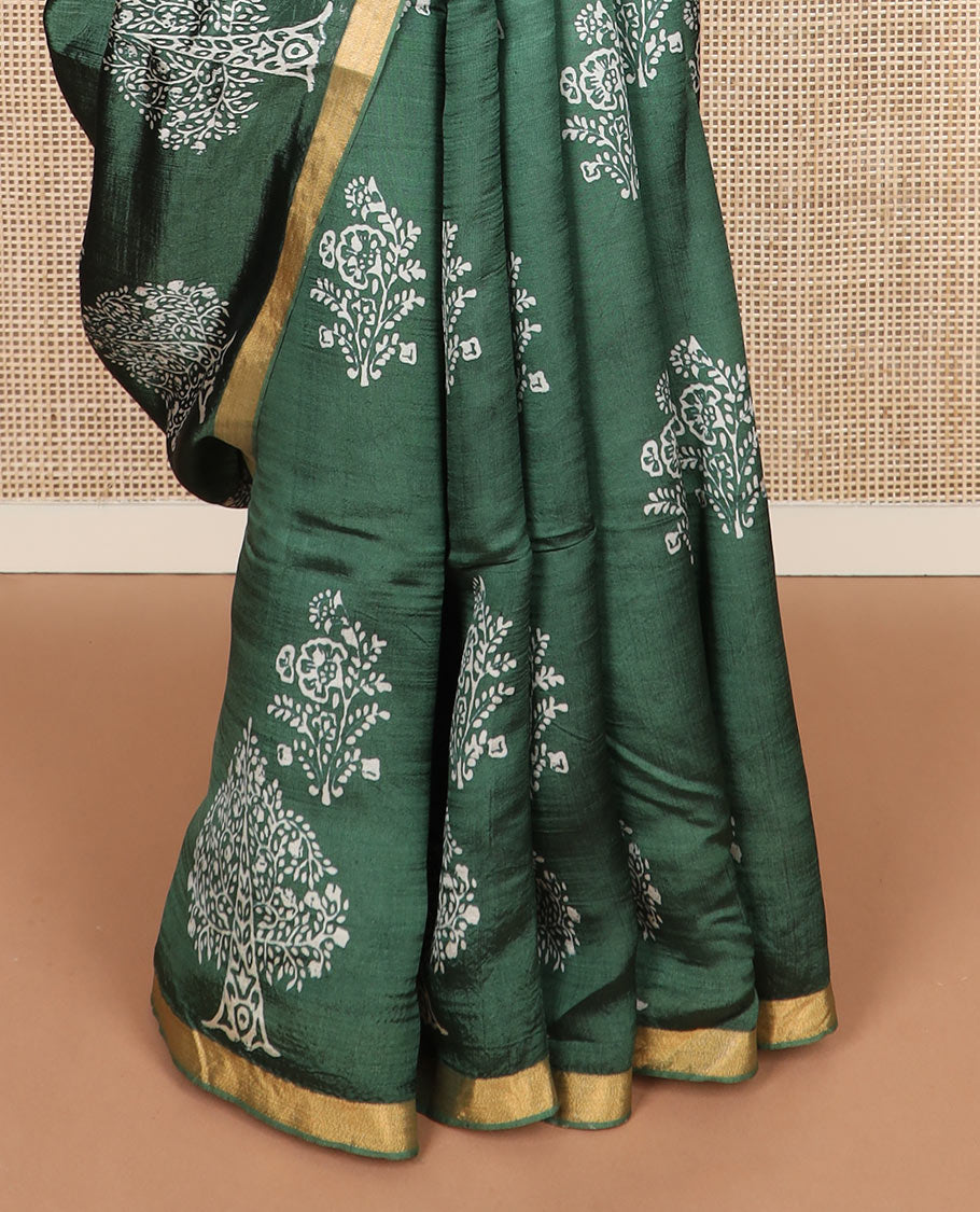 Green tree motifs printed banana pith saree, zari border, and floral printed pallu