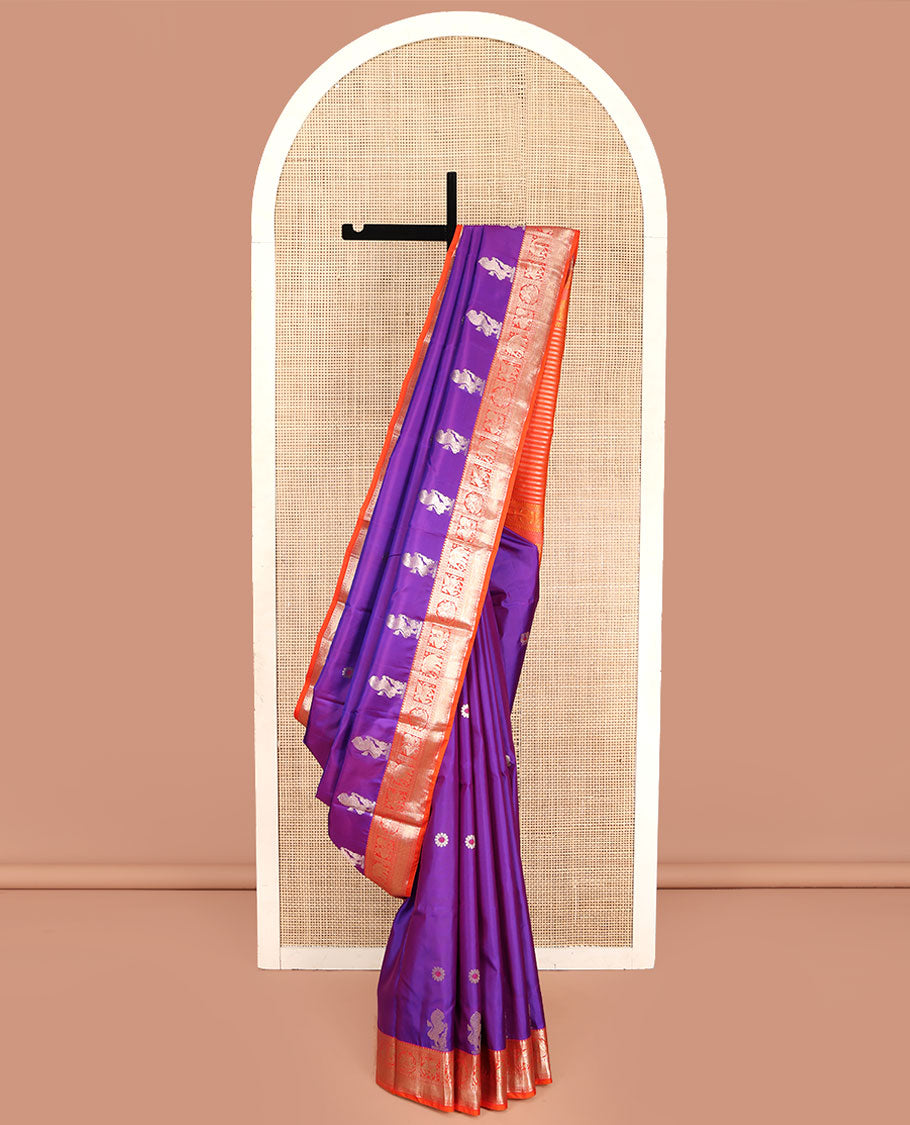 Purple Vasundhara Silk Saree, Embellished with Meena Buttas and Singam Buttas All Over Its Body, Complemented by Contrast Border of Rekku, Banaras, Yaanai, Mayil, and Vanki Designs, Pallu of Muthu Designs, and Paired with a Contrast Blouse