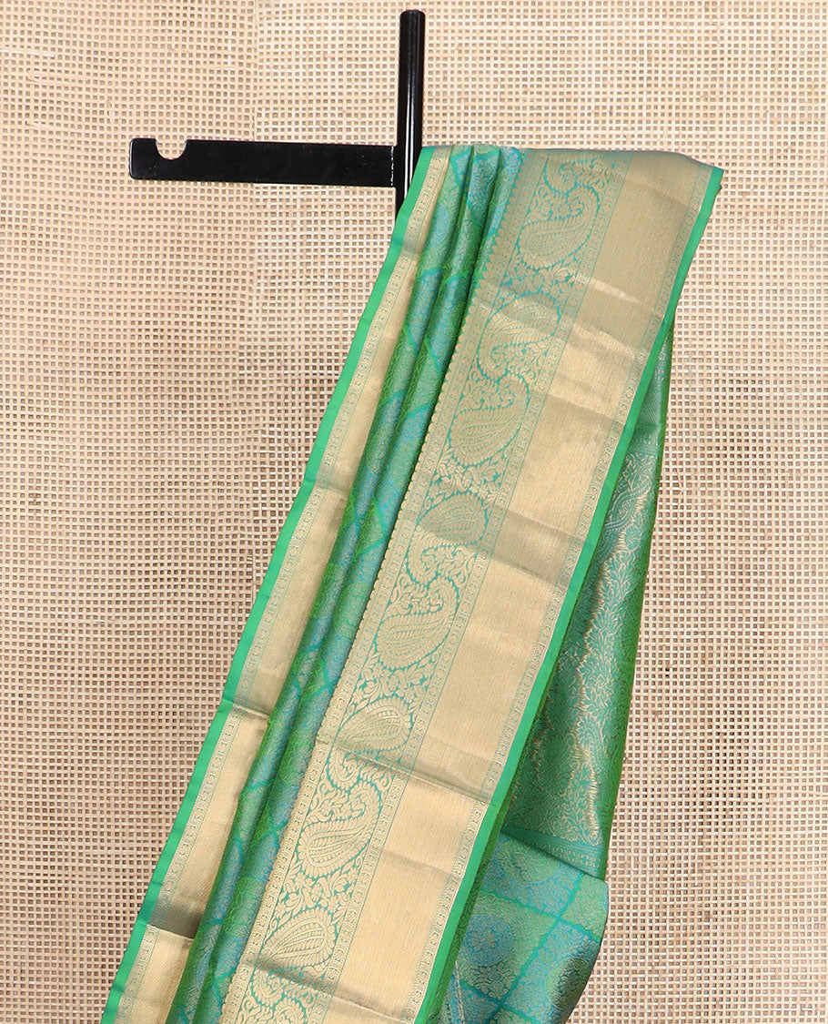 Green jacquard Kanchipuram wedding silk saree, zari border of arumbu manga designs, and intricate pallu