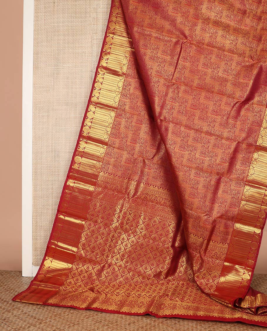 Light maroon jacquard Kanchipuram wedding silk saree, zari border of dhavana kodi, kathir, and mayil chakram, and ogee patterned pallu