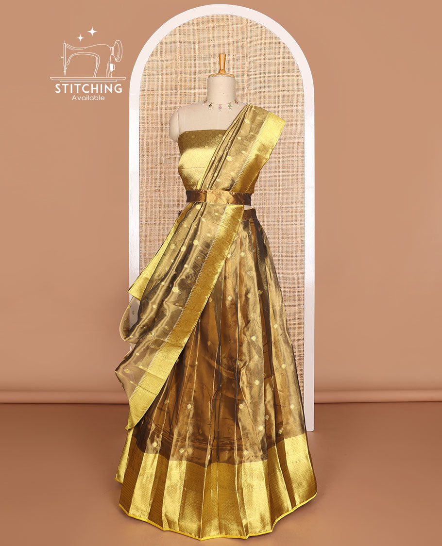 Bronze color buttas tissue half saree with contrast zari design border, zari design blouse & floral design dhavani