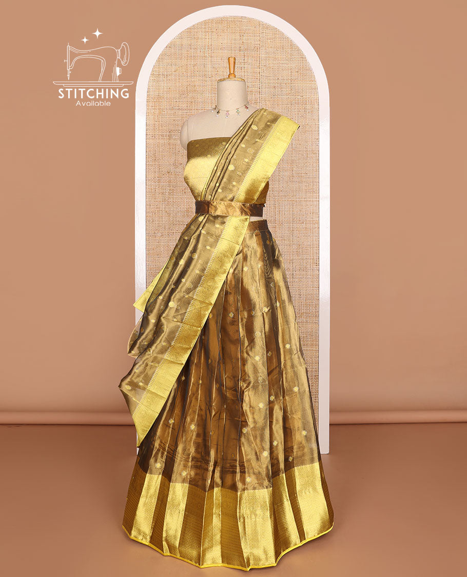 Bronze color buttas tissue half saree with contrast zari design border, zari design blouse & floral design dhavani