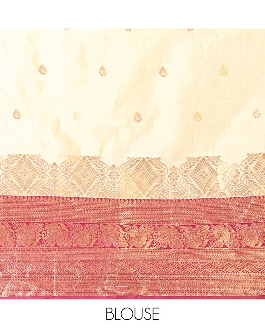 Cream-magenta art-silk half-saree, zari buttas with contrast traditional design bordered skirt, a matching blouse, and scallop stone work dhavani