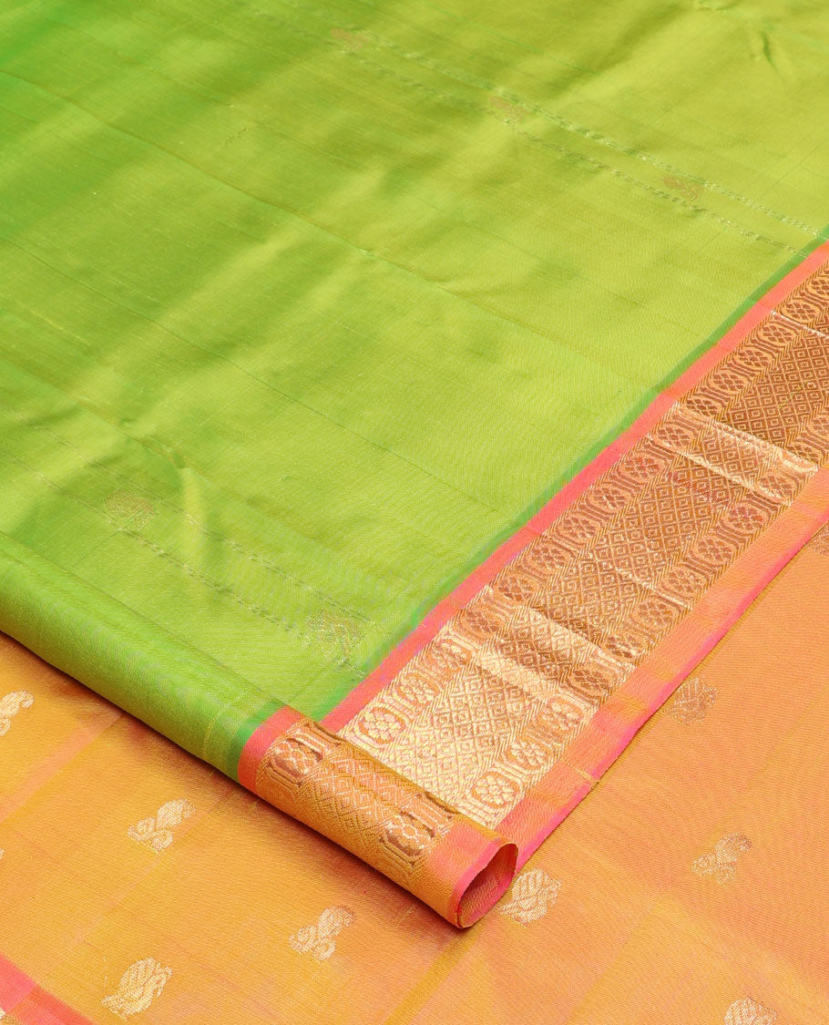 Green mayil buttas and zari stripes Kanchipuram silk saree, contrast one-sided border of laddu kamalam, and mayil kann designs, and zari design pallu