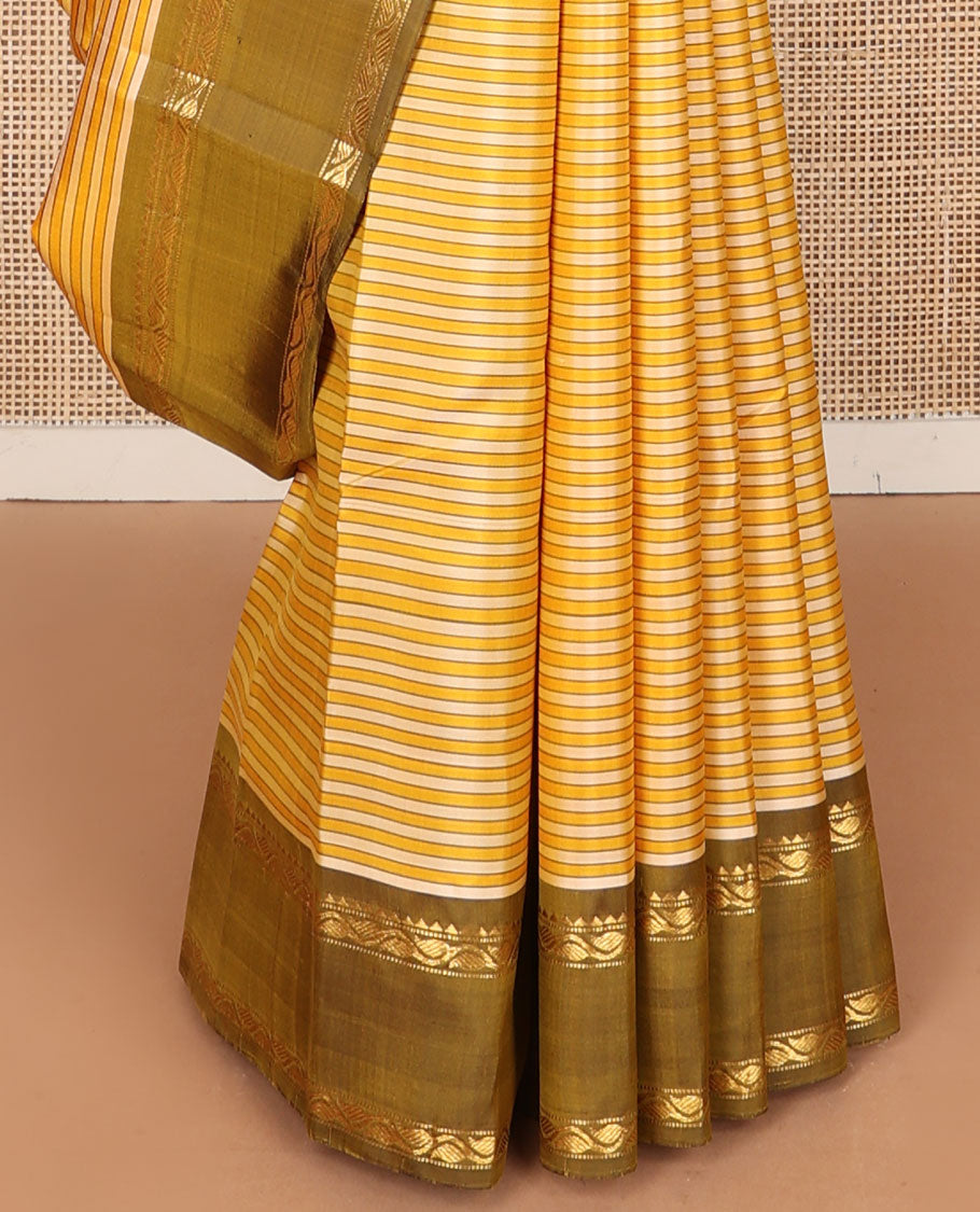 Yellow striped kanchipuram silk saree, contrast rettai pettu border of rekku, muthu & leaf vine & pallu of zari stripes