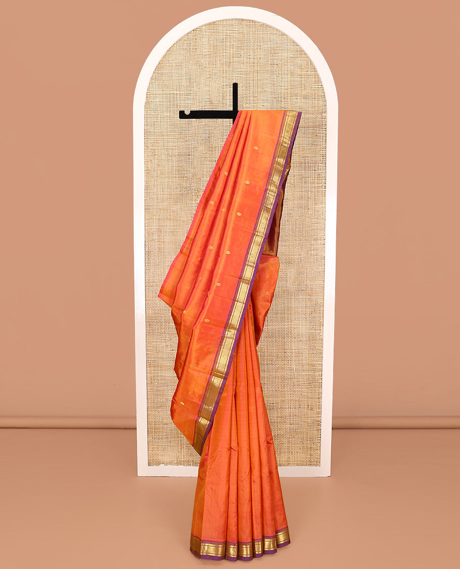 Orange Kanchipuram Silk Saree, Crafted with Zari Buttas All Over Its Body, Complemented by a Contrast One-Sided Border of Banaras, and Mayil Kann Designs, Pallu of Zari Designs, and Comes Without a Blouse