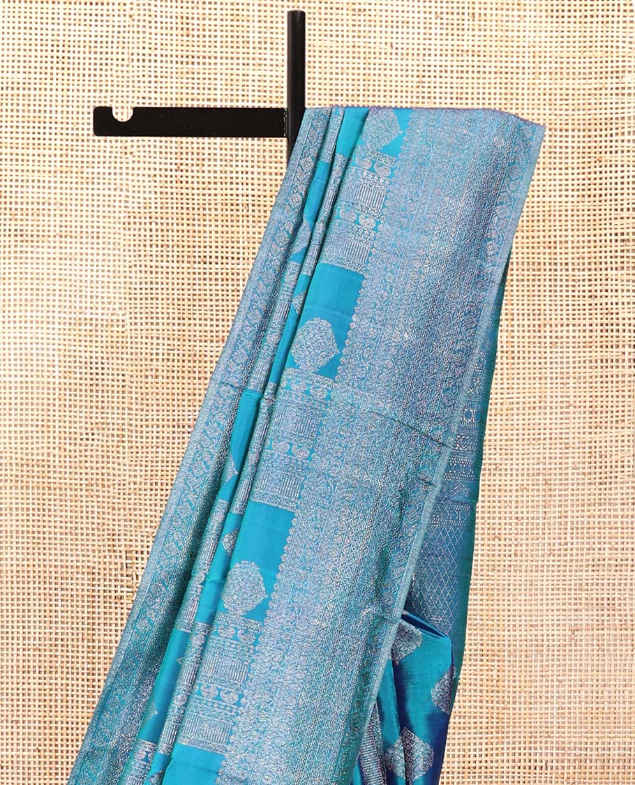 Blue Kanchipuram Designer Silk Saree, Subtly Enriched with Zari Designs Woven All Over Its Body, Highlighted by Zari Traditional Border, Zari Woven Pallu, and Paired with a Matching Blouse