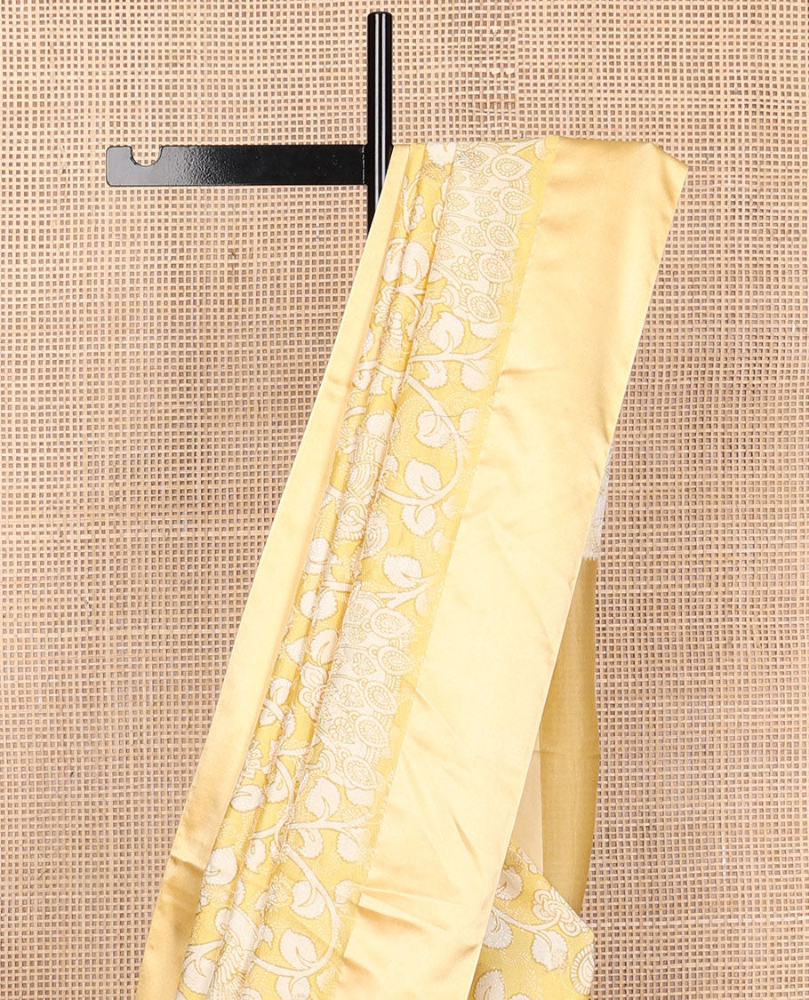 Yellow kalamkari-style floral vine & peacock printed tussar saree with zari buttas, plain border & plain pallu