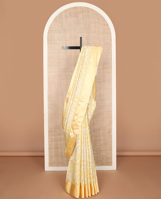 Yellow kalamkari-style floral vine & peacock printed tussar saree with zari buttas, plain border & plain pallu