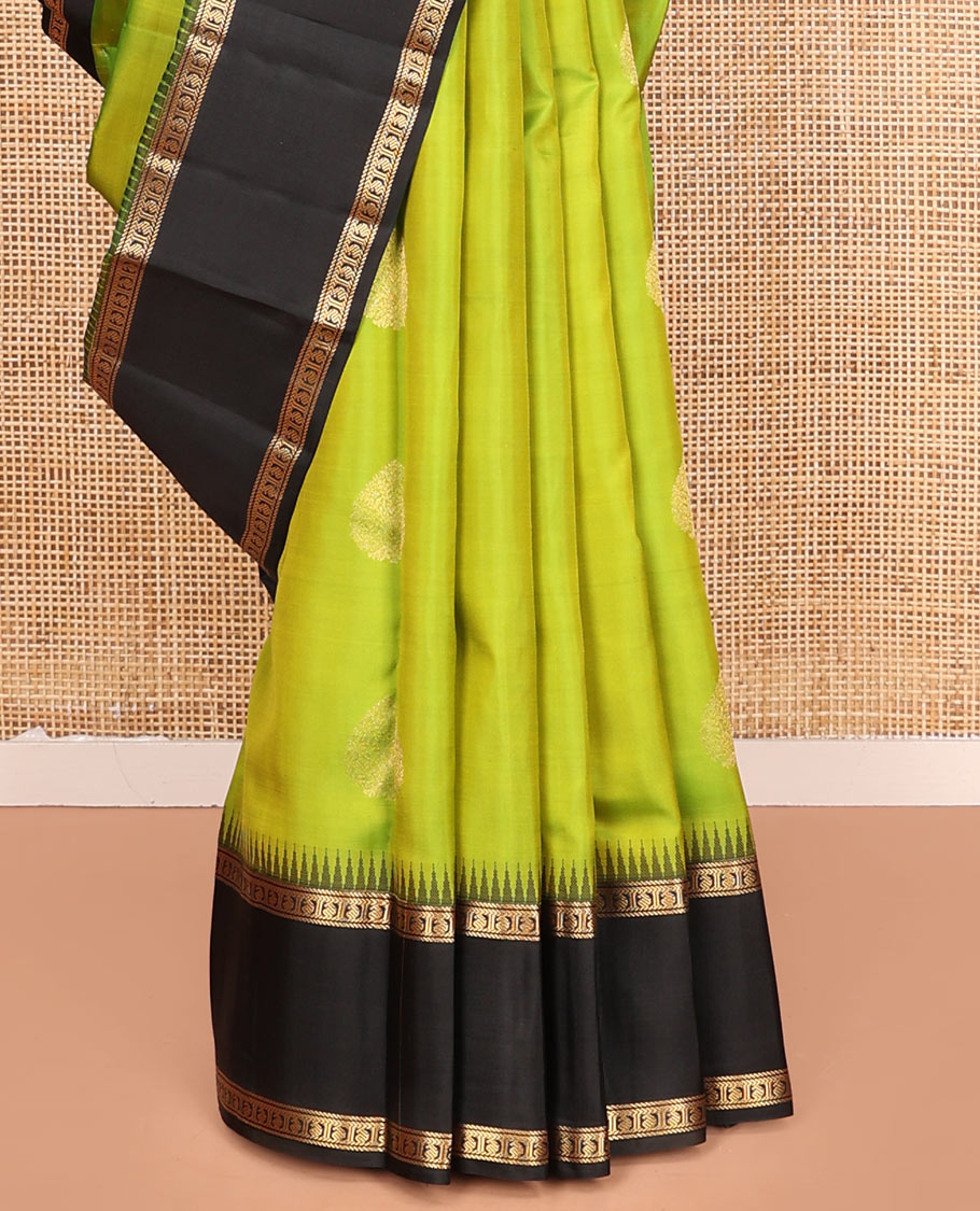 Green Vasundhara Silk Saree, Detailed with Zari Buttas on Its Body, Complemented by Contrast Temple Border of Banaras, Kathir, and Manga Designs, Grandly Woven Jaal Pallu, and Paired with a Contrast Blouse