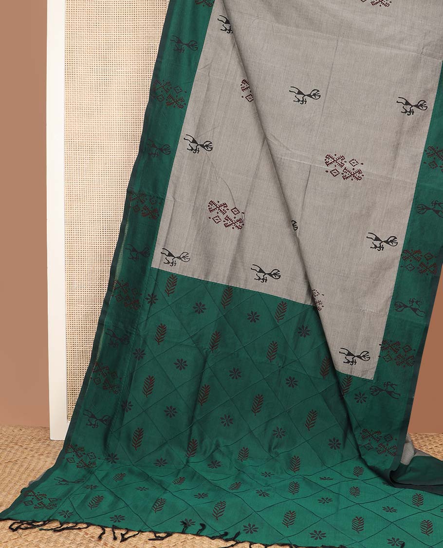 Grey warli motifs printed poly cotton saree, contrast warli motifs border, and buttas enclosed jaal pallu