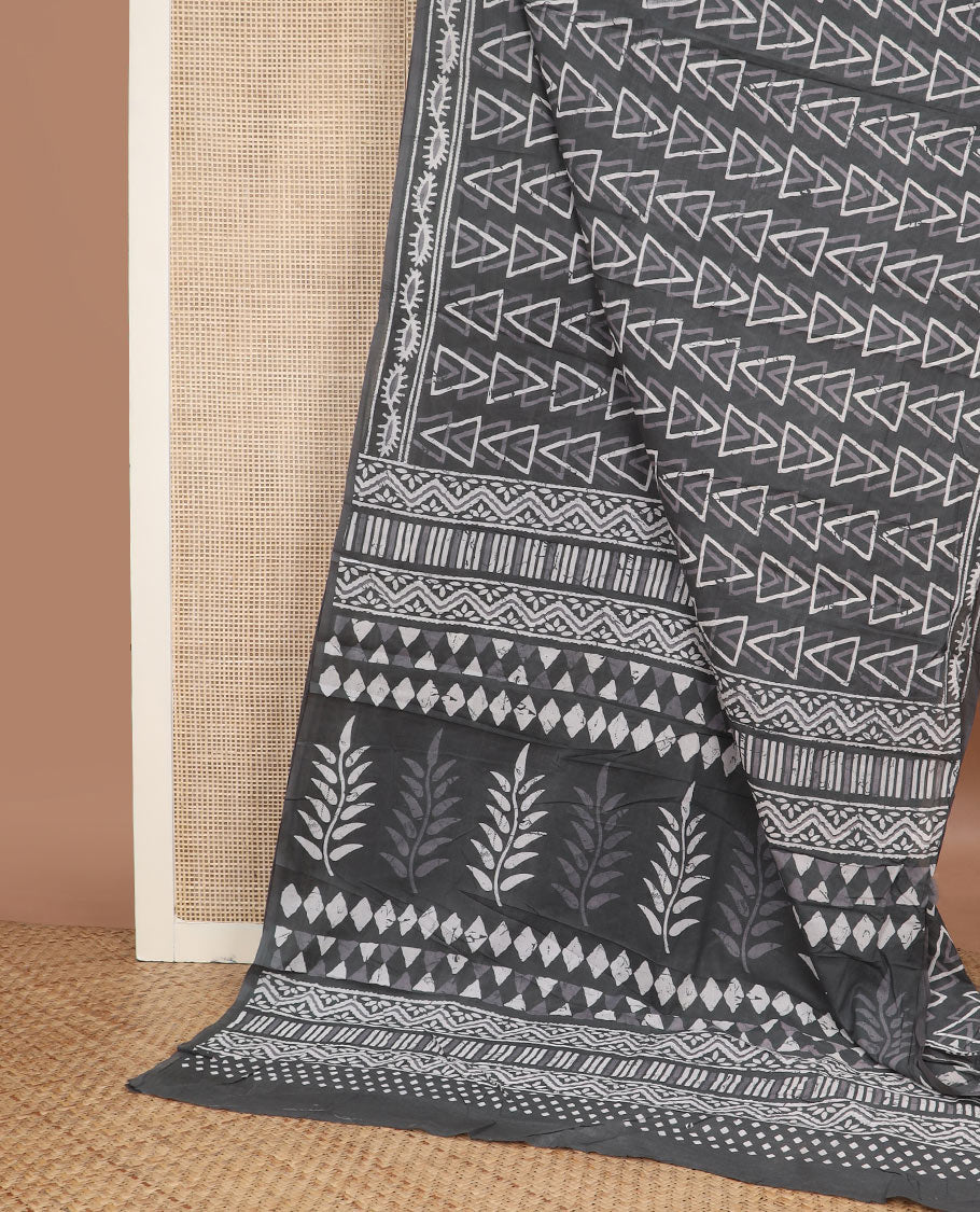 Grey batik-style triangle motifs mul mul cotton saree, batik-style printed border & floral-geometric printed pallu