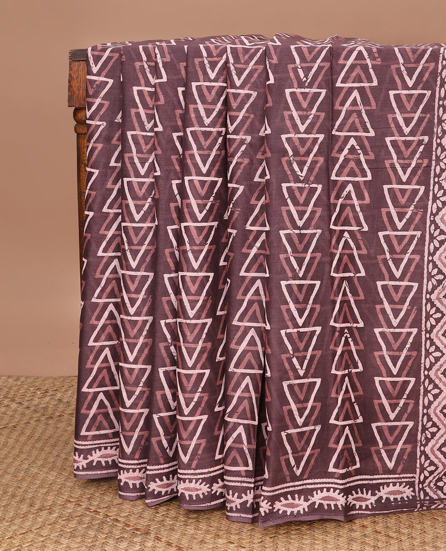 Brown batik-style triangle motifs mul mul cotton saree, batik-style printed border & floral-geometric printed pallu