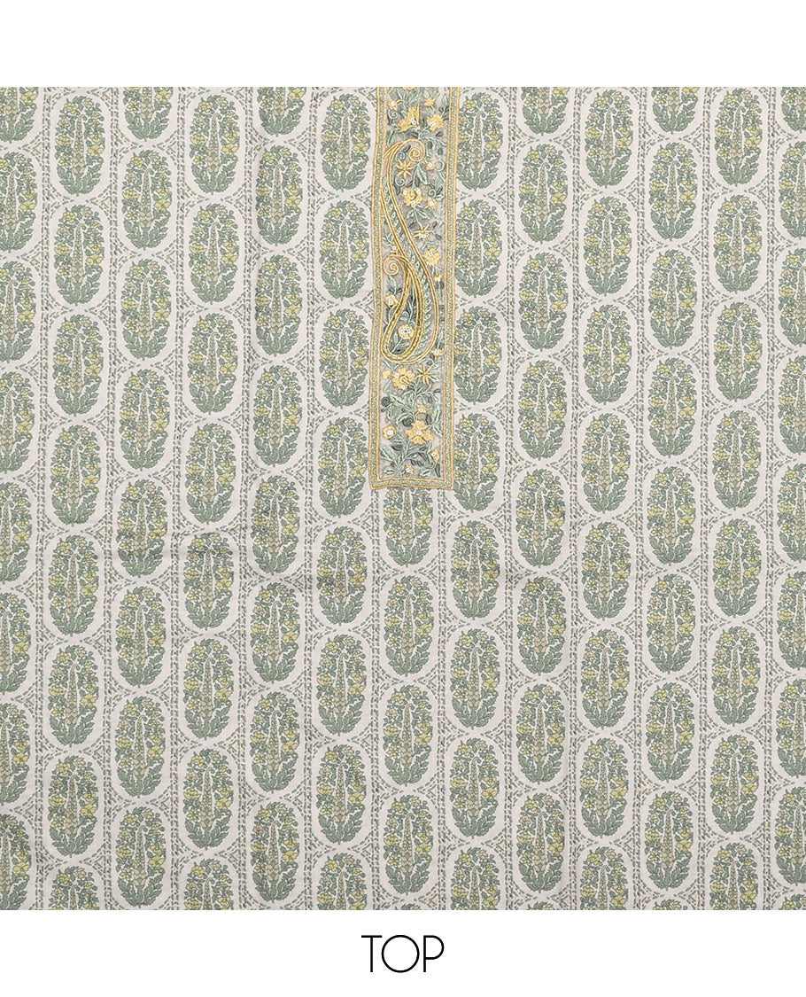 Yellow material chudidar set, intricately printed with neck work top, plain bottom, and floral motifs embroidered dupatta