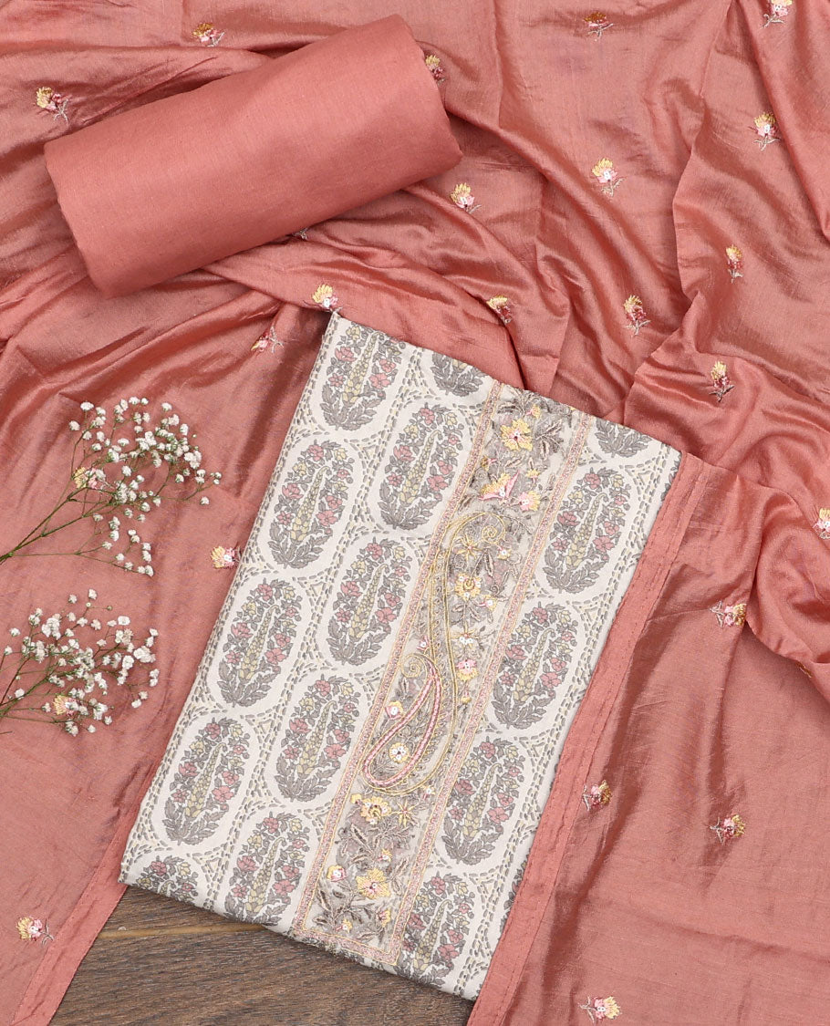 Peach material chudidar set, intricately printed with neck work top, plain bottom, and floral motifs embroidered dupatta