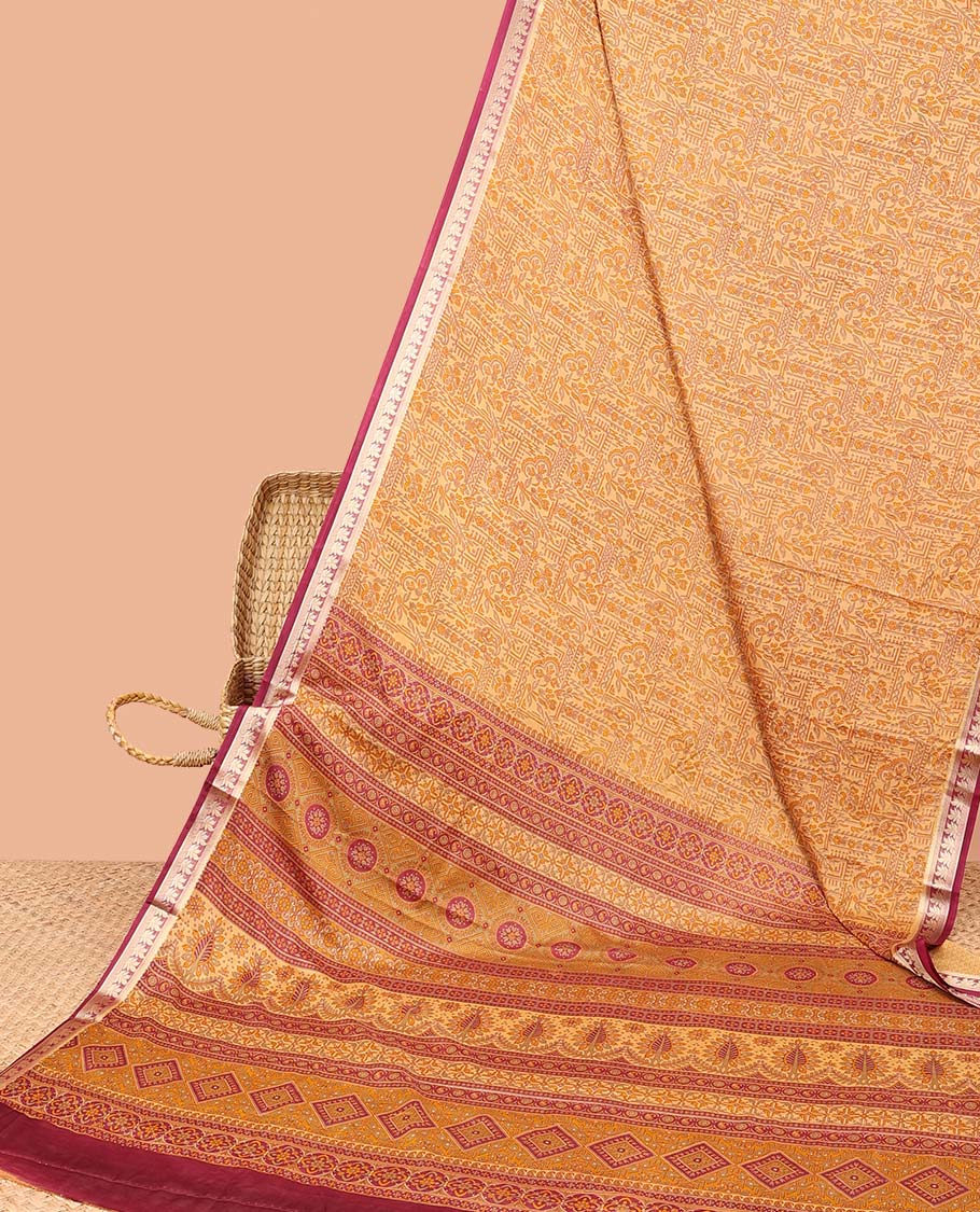 Orange intricately printed semi-banaras printed saree, contrast floral border & intricate pallu