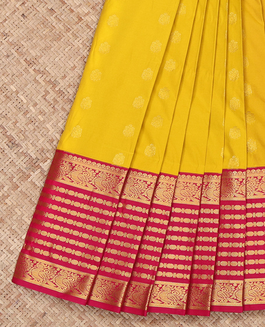 Yellow Budget Silk Saree, Sparsely Sparkled with Zari Buttas All Over Its Body, Complemented by Contrast Traditional Zari Border of Peacock and Rudrksham Designs, Grand Jaal-Patterned Pallu, and Paired with a Contrast Blouse