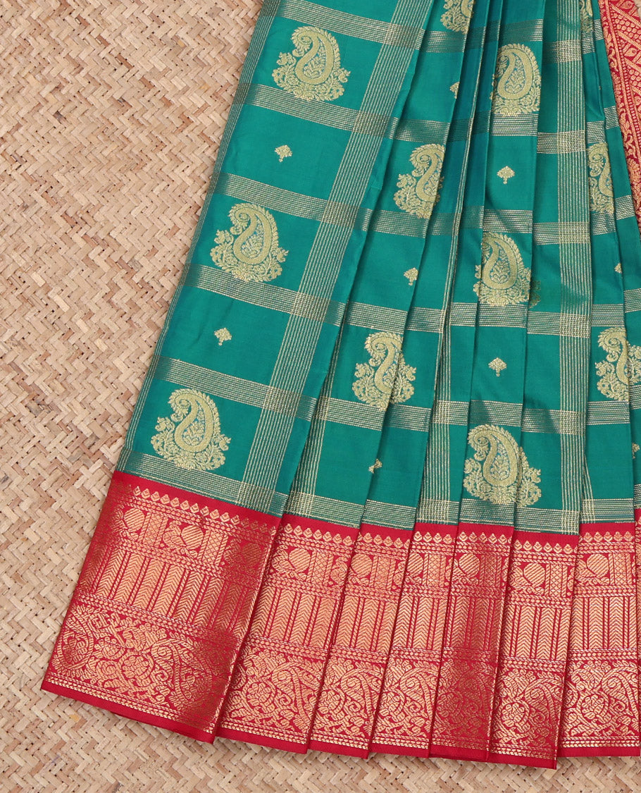 Green Budget Silk Saree, Decked Up with Paisley Butta Enclosed Checks on Its Body, Complemented by a Contrast Traditional Zari Design Border, Grandly Decked Up Pallu, and Paired with a Contrast Blouse
