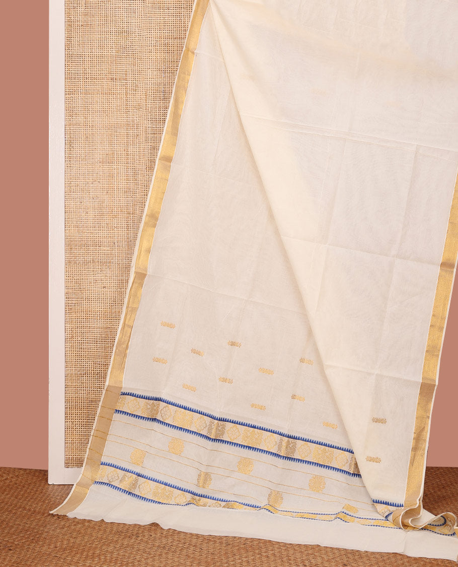 Cream Kerala Cotton Saree Finely Woven with Buttas All Over Its Body, Bavanji Border, Pallu of Intricate Designs, and Paired with a Matching Blouse