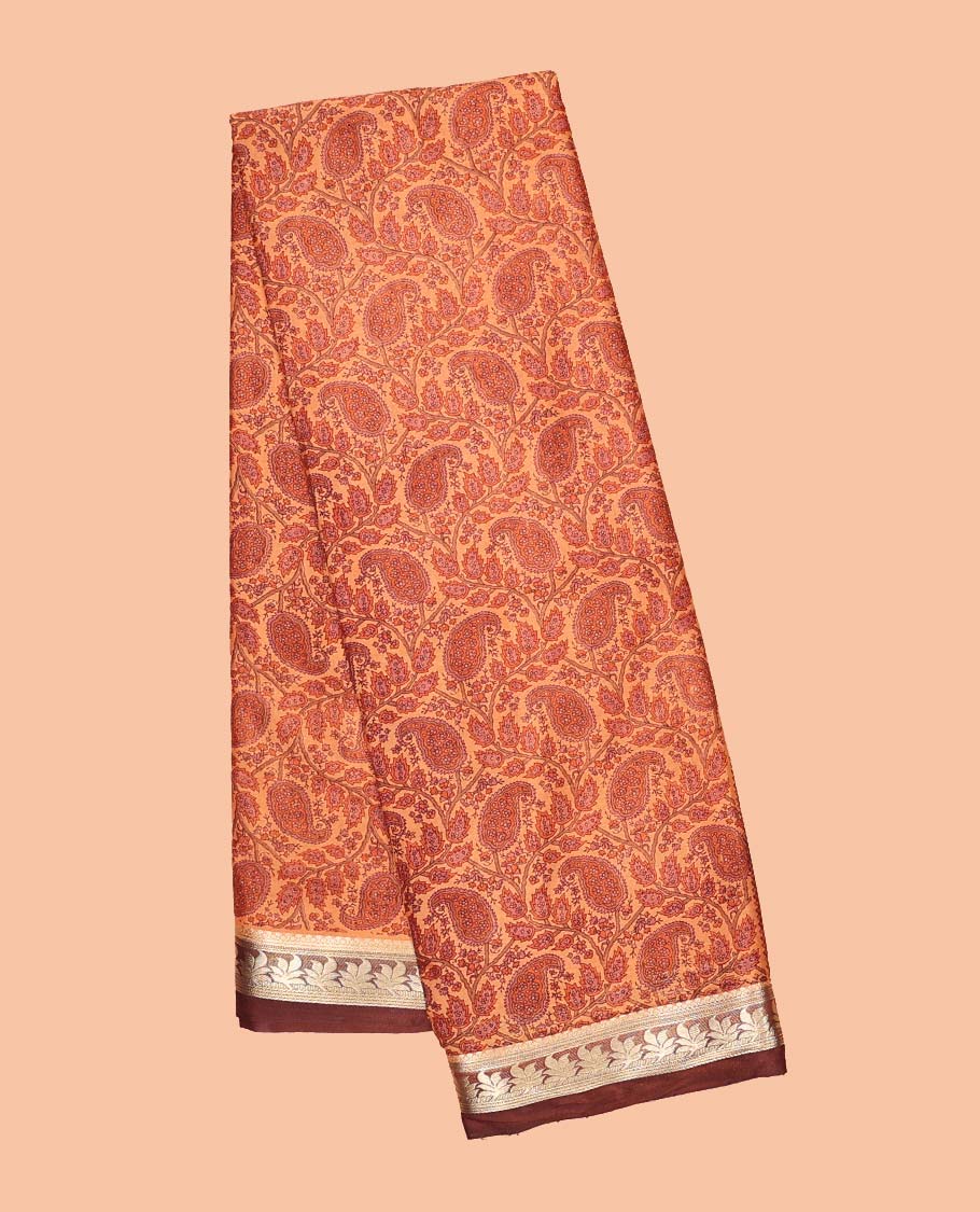 Orange paisley printed semi-banaras printed saree, contrast floral border & intricate pallu