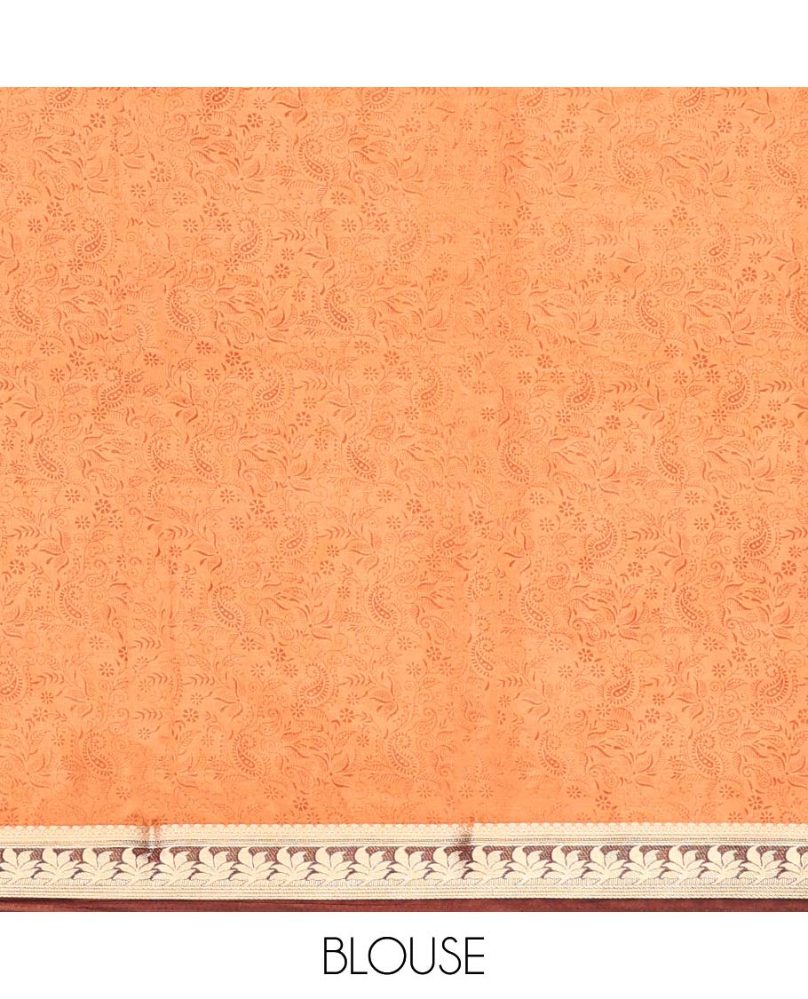 Orange paisley printed semi-banaras printed saree, contrast floral border & intricate pallu