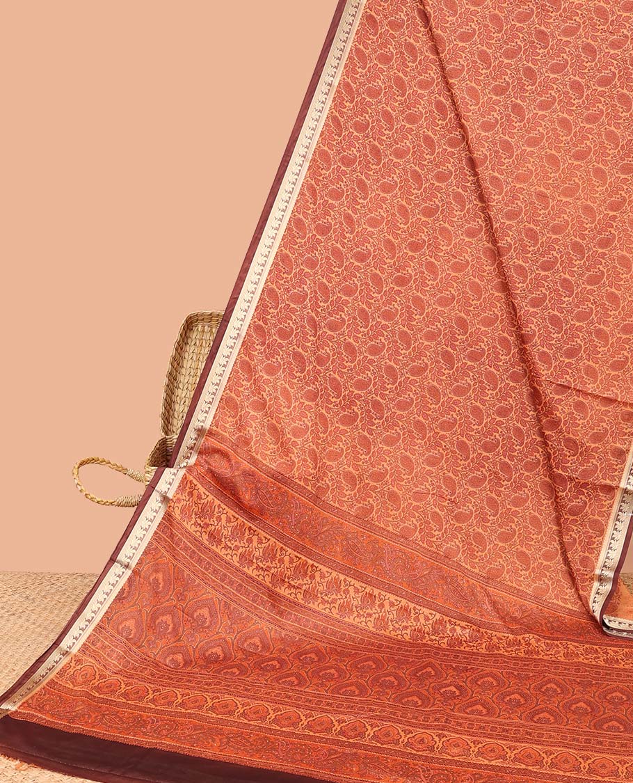 Orange paisley printed semi-banaras printed saree, contrast floral border & intricate pallu