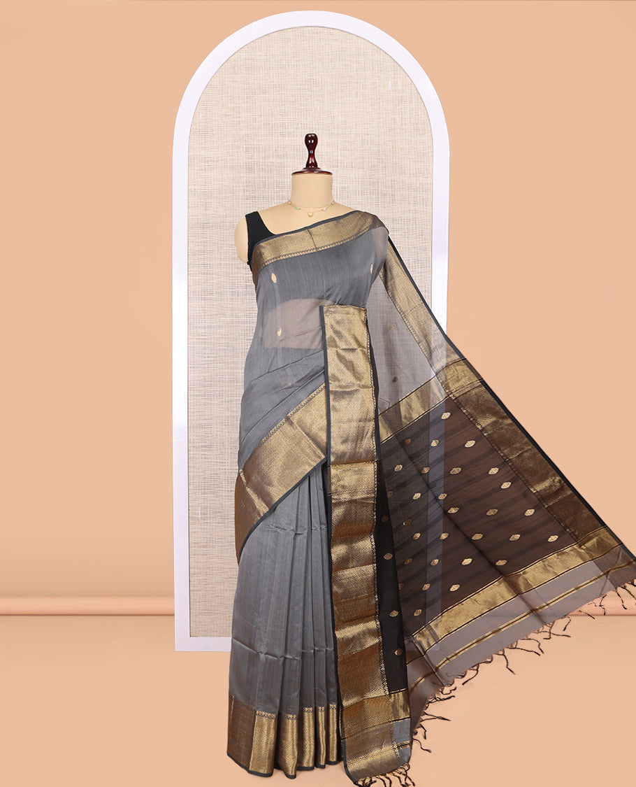 Grey Maheshwari Cotton Saree, Adorned with Buttas, Highlighted by a Traditional Zari Border, Pallu Gleamed Up with Zari Buttas, and a Contrast Blouse