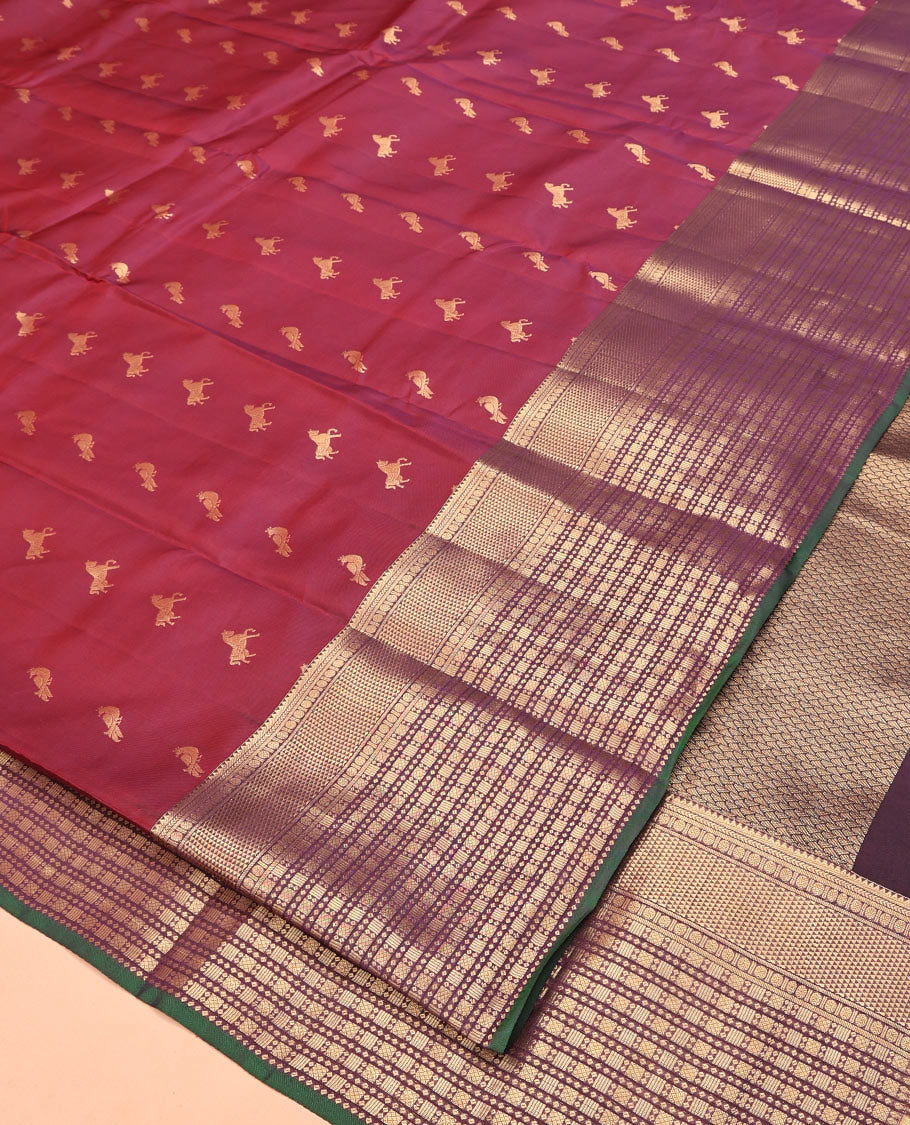 Maroon Vasundhara Lite Silk Mix Saree, Embellished with Zari Buttas All Over Its Body, Complemented by Contrast Border of Rekku, Kathir, Poun, Ara Maadam, and Geometric Patterns, Grand Pallu and Paired with a Contrast Blouse