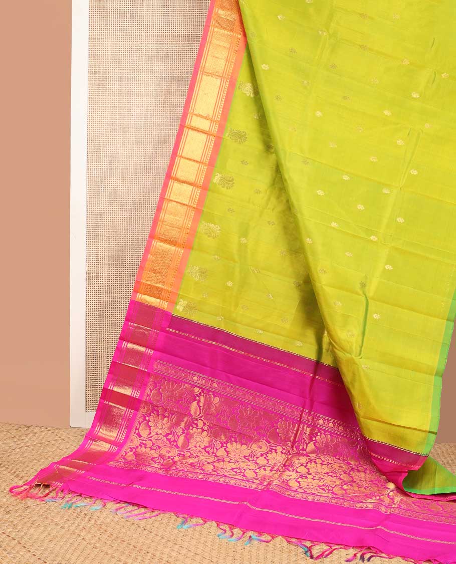Light green buttas kancheepuram silk saree with contrast border of thilakam moku, banaras, kuyil kann design & zari design pallu