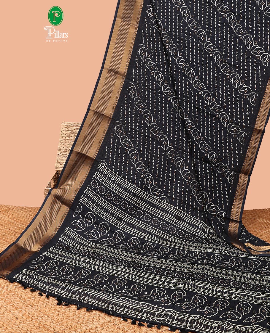 Black all-over bandani print dola silk saree with contrast copper thread gatt border & bandhani print blouse