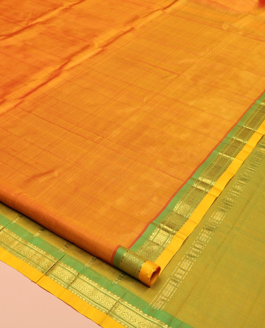 Orange Kanchipuram Silk Saree, Woven with Zari Buttas, Complemented by a Contrast One-Sided Border of Rekku and Jaal Designs, Zari Design Pallu, and No Blouse