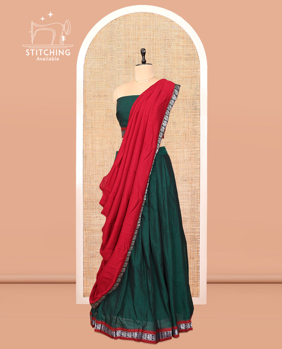 Green Cotton Half-Saree Features Plain Skirt, a Contrast Peacock Border, a Matching Blouse, and a Contrast Red Dhavani