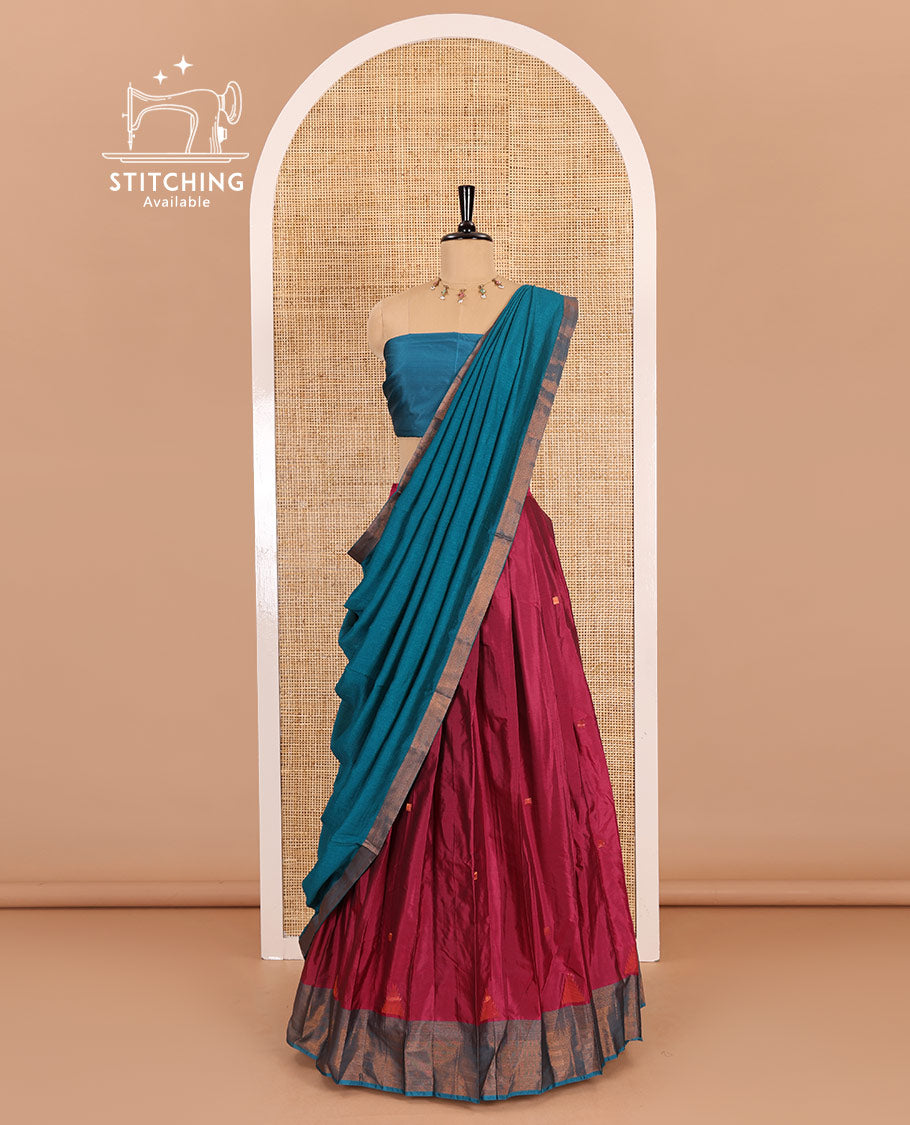 Rani pink and blue half-saree, buttas with traditional zari bordered taffeta silk skirt, a plain blouse, and a contrast vichitra silk dhavani