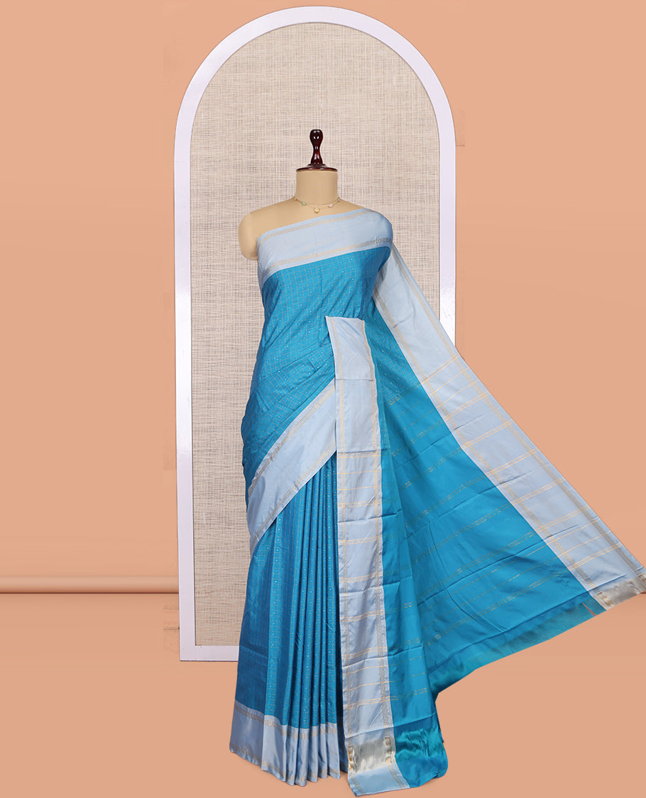 Blue Arani Saree, Features Zari Butta Enclosed Checks, a Contrast Bodi Border, Pallu of Zari Stripes, and a Matching Blouse