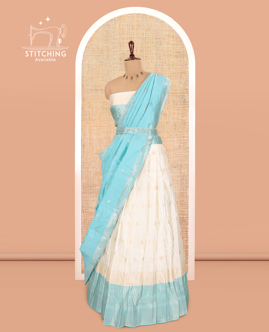 Cream-Blue Semi-Silk Half-Saree, Subtly Sparkled with Zari Buttas Skirt, a Contrast Traditional Zari Border, and a Contrast Dhavani