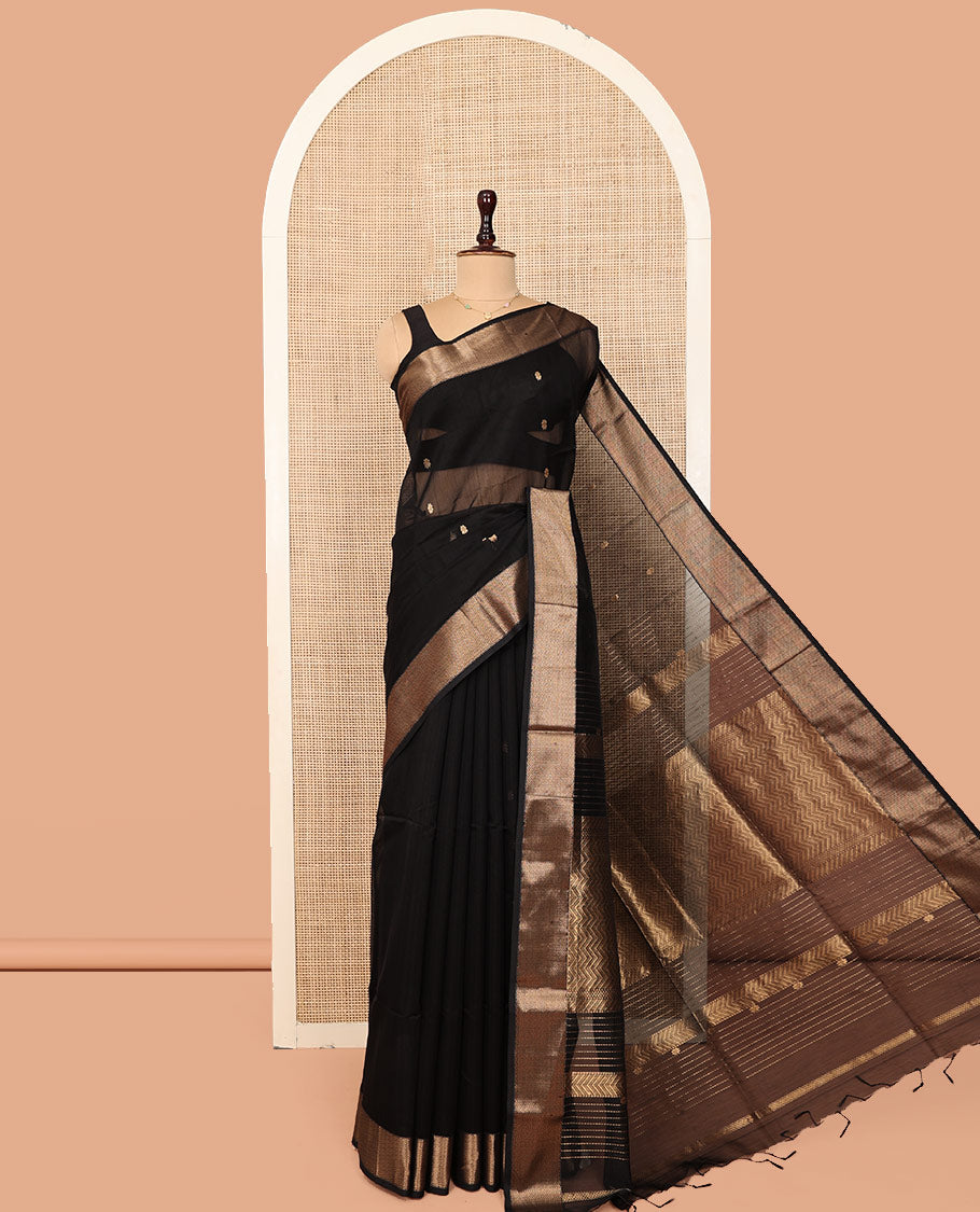 Black Maheshwari Cotton Saree, Spotlighted by Buttas All Over Its Body, Highlighted by a Traditional Zari Border of Chevron Stripes, Pallu of Chevron Stripes, and Paired with a Matching Blouse