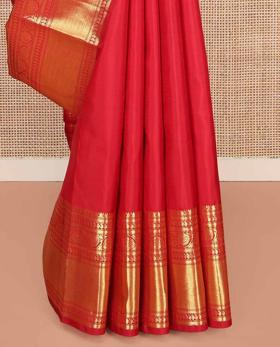 Red Kanchipuram Silk Saree, Subtly Sparkled with Zari Buttas All Over Its Body, Highlighted by a Zari Border of Thilakam, Kathir, Manga, and Dhavana Kodi Designs, Pallu of Jaal and Mayil Designs, and Paired with a Matching Blouse