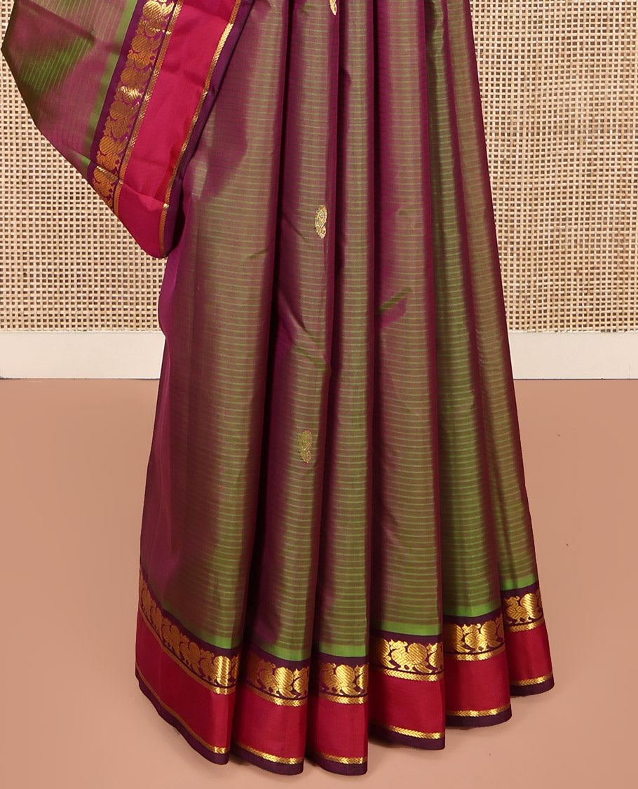 Green Kanchipuram Silk Saree, Sparsely Sparkled with Vazhaipoo Stripes and Zari Buttas on Its Body, Complemented by Contrast Rettai Pettu Border of Mayil, and Kathir Designs, Zari-Striped Pallu, and Paired with a Contrast Blouse
