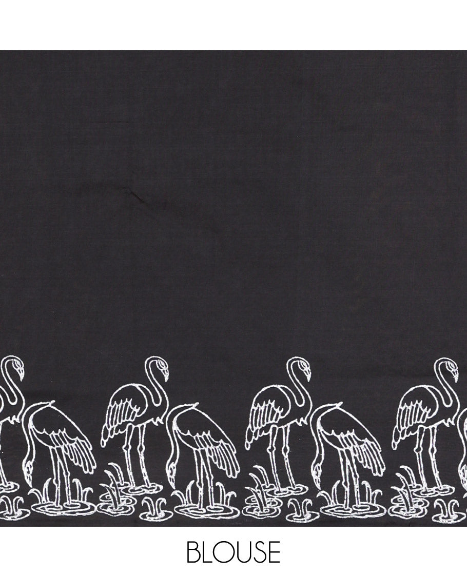 Black South Cotton Saree, Highlighted with Floral Motifs Printed All Over Its Body, Flamigo Motifs Printed Border, and Paired with One Matching Flamigo Printed Blouse, One Contrast Floral Motifs Block Printed Blouse