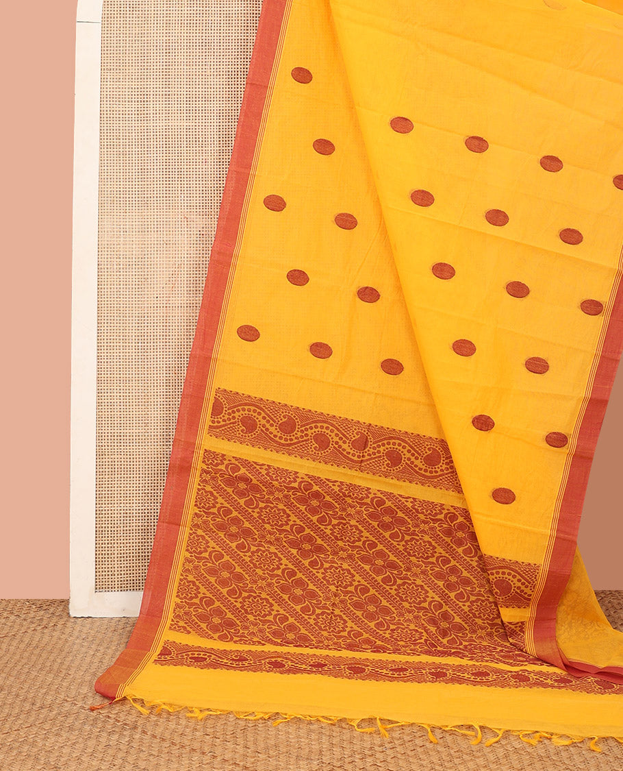 Yellow Kanchi Cotton Saree, Decked Up with Polka Dot Buttas All Over Its Body, Complemented by a Contrast Border, Pallu Depicting Floral Designs, and Paired with a Matching Blouse