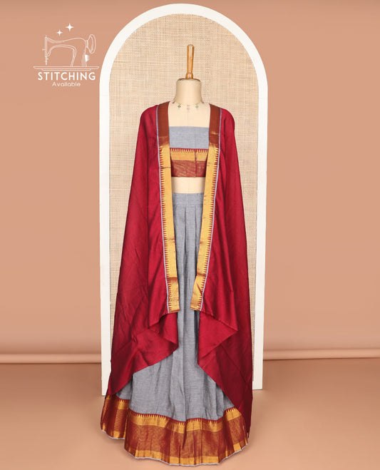 Grey cotton half saree with contrast checked, temple border, zari design blouse & temple border dhavani