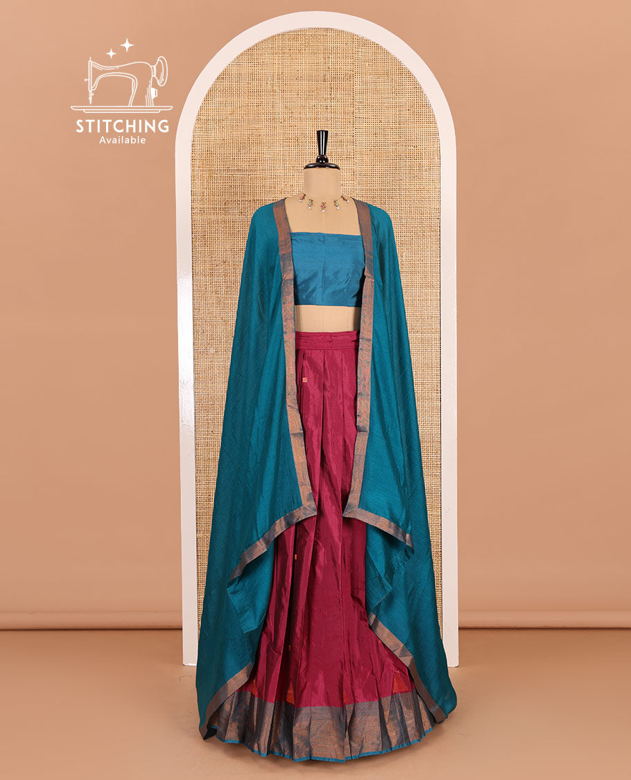Rani pink and blue half-saree, buttas with traditional zari bordered taffeta silk skirt, a plain blouse, and a contrast vichitra silk dhavani